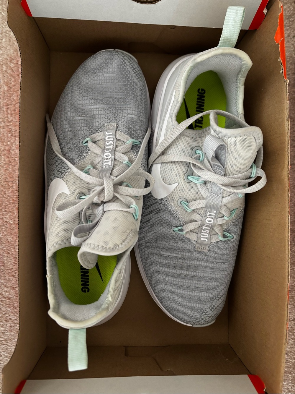 Nike Women’s Light Gray Athletic Sneakers with Mint Highlights